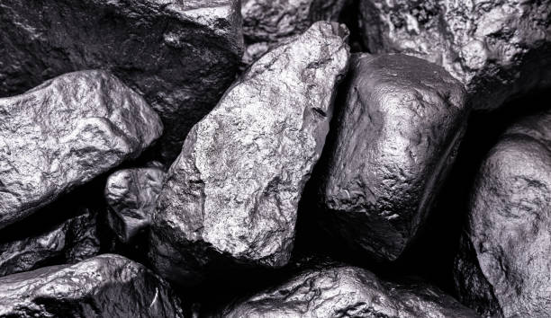 High-grade manganese ore stones in dark metallic tones used for steelmaking, alloy production and industrial applications.